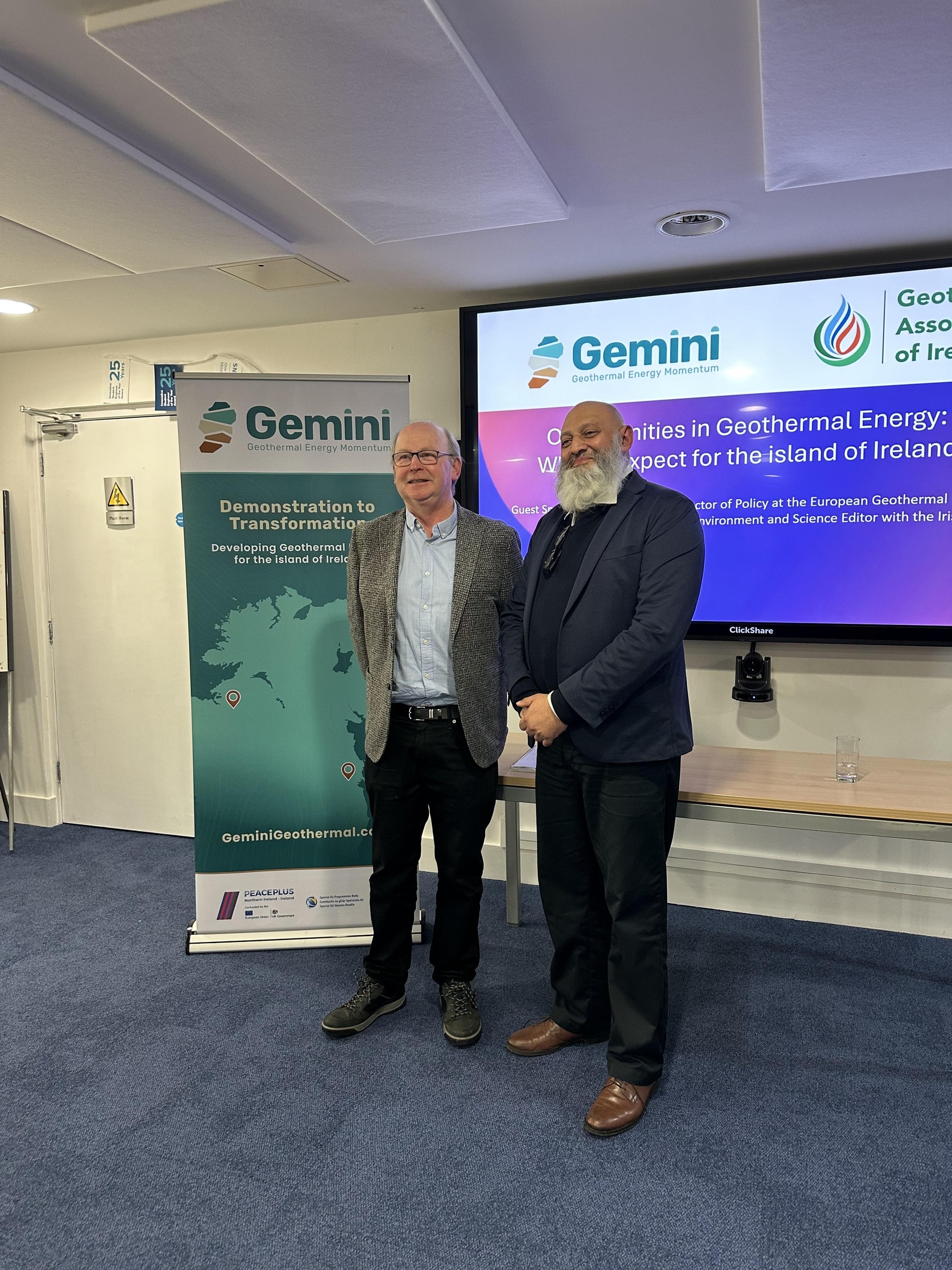Kevin O'Sullivan stand side by side in front of a GEMINI banner